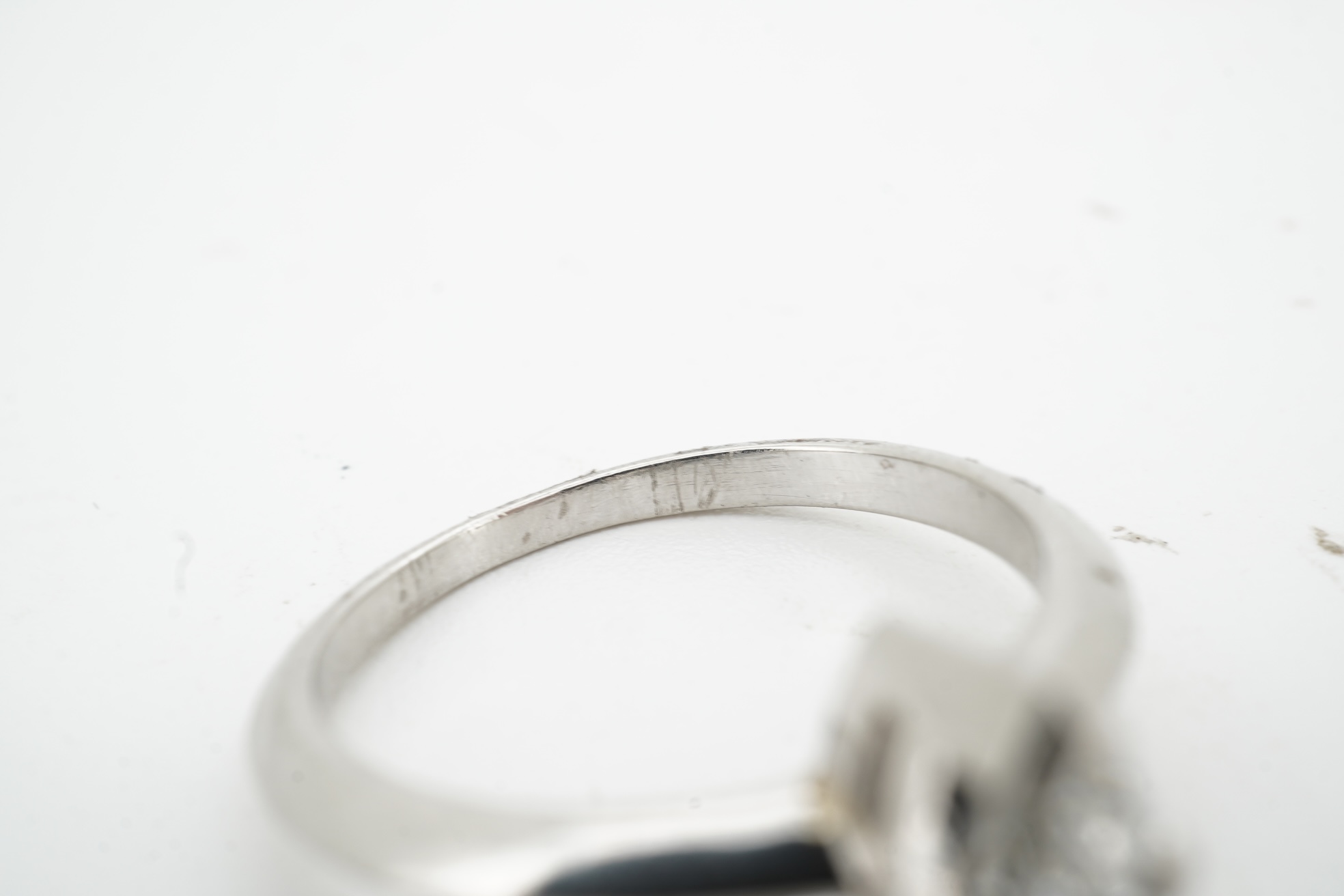 A diamond ring, claw-set with a marquise-shaped diamond weighing approximately 0.50 carats, mounted in platinum, size L, British hallmarks, gross weight approximately 4 grams